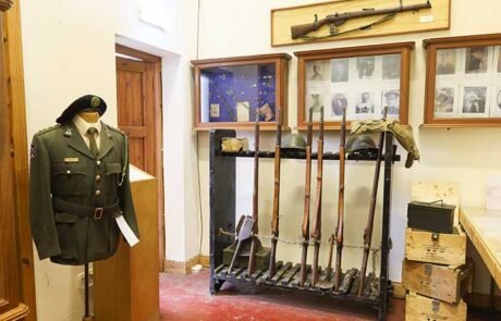 old army uniform and guns 