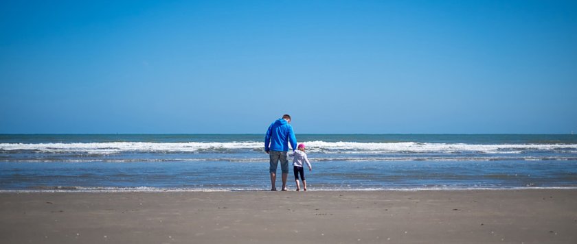 man and child on the beach in Ireland